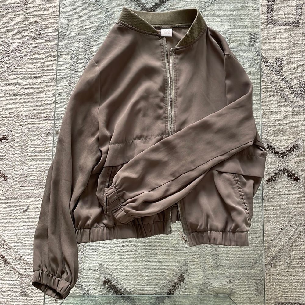 Green bomber, size M. Fits like a small